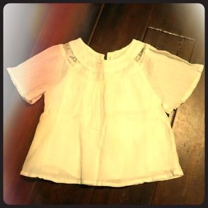 Cream colored sheer blouse w/2 buttons on back